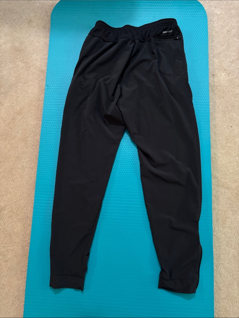 Nike Black Track Pants with White Swoosh and Reflective Accents - Picture 2 of 3
